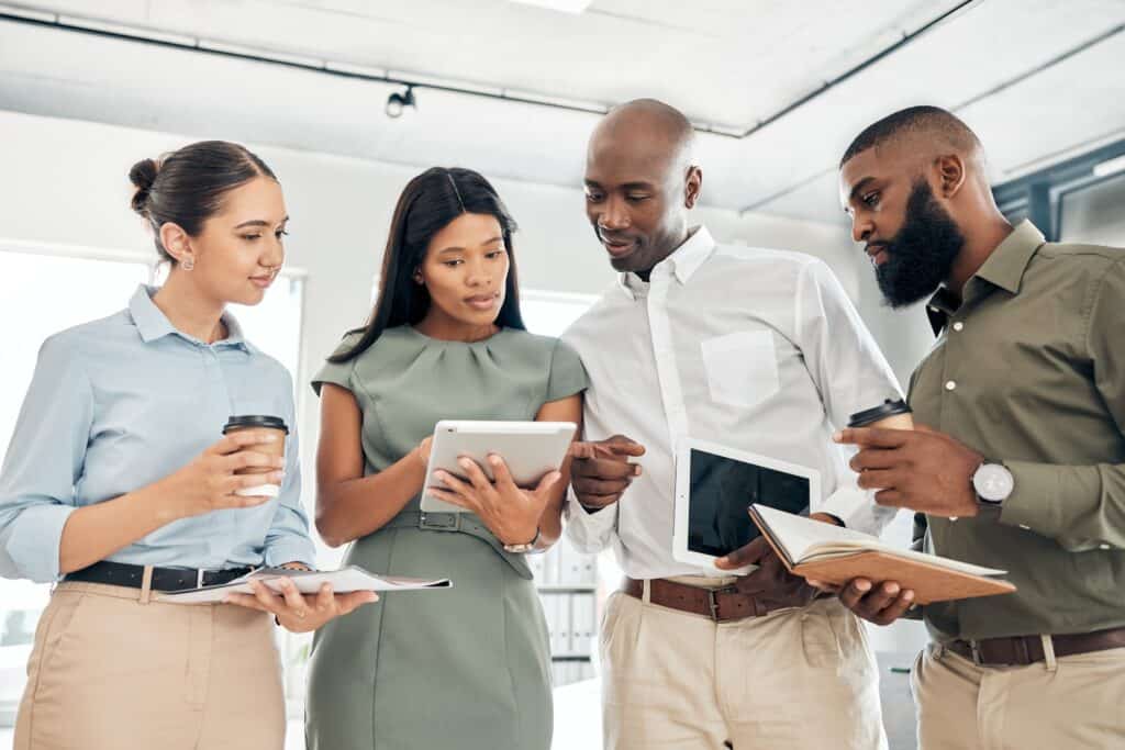 Small Business Website Design Small Business Website Design Business planning on tablet in meeting, talking about company website and discussion about advertis