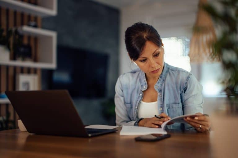 Stressed woman searching for a solution for business problem.